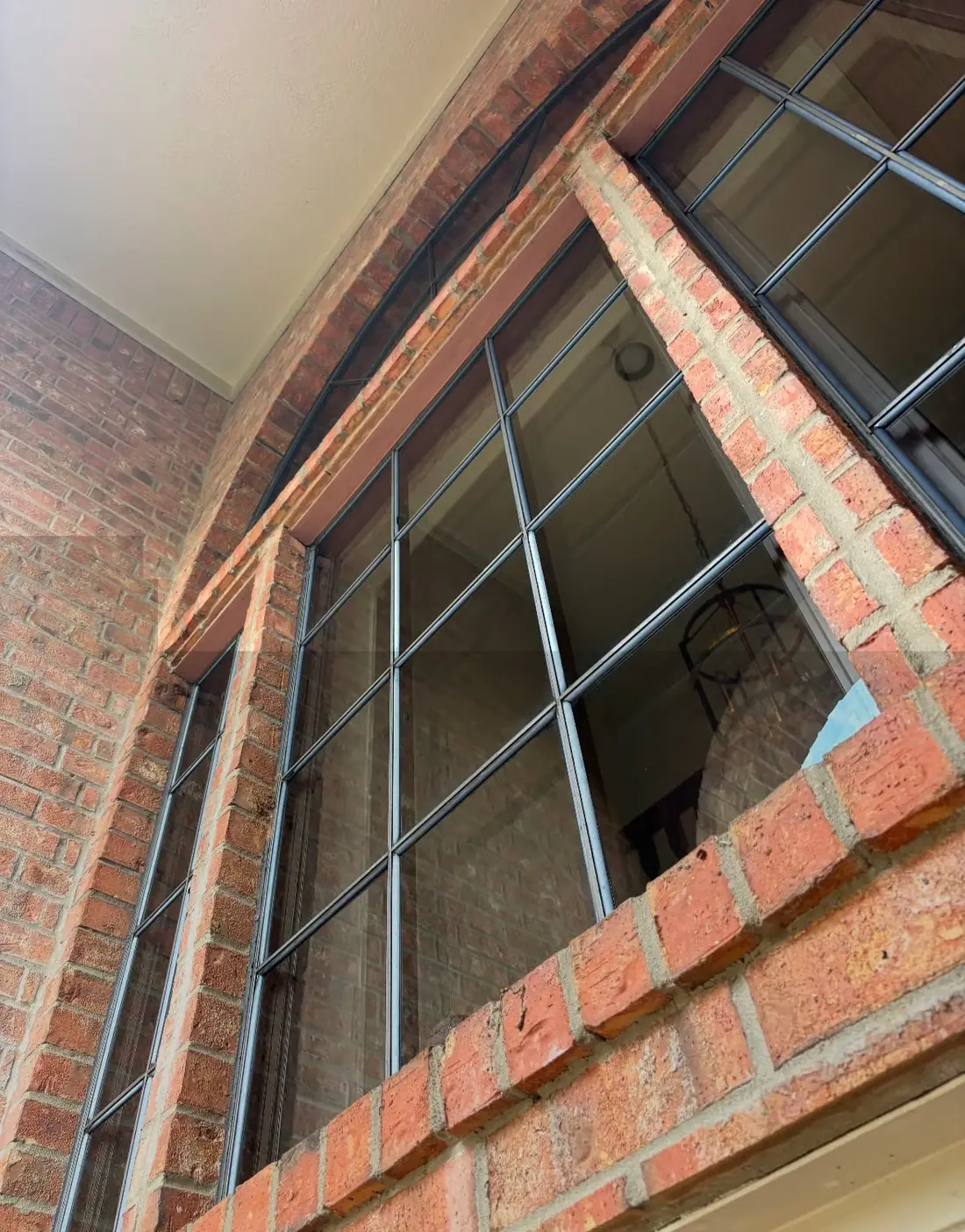 Commercial building glass cleaned by Strive